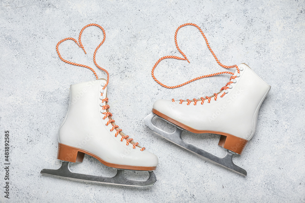 Ice skates on light background