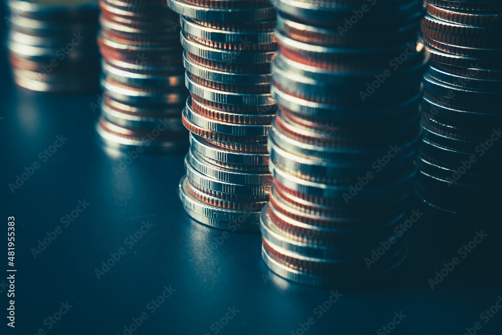 Pile of gold coins stack in finance treasury deposit bank account for saving . Concept of corporate 