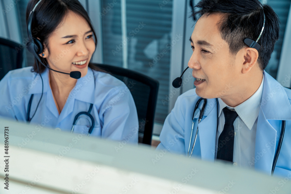 Doctor team wearing headset talking actively on video call in hospital clinic . Concept of telehealt