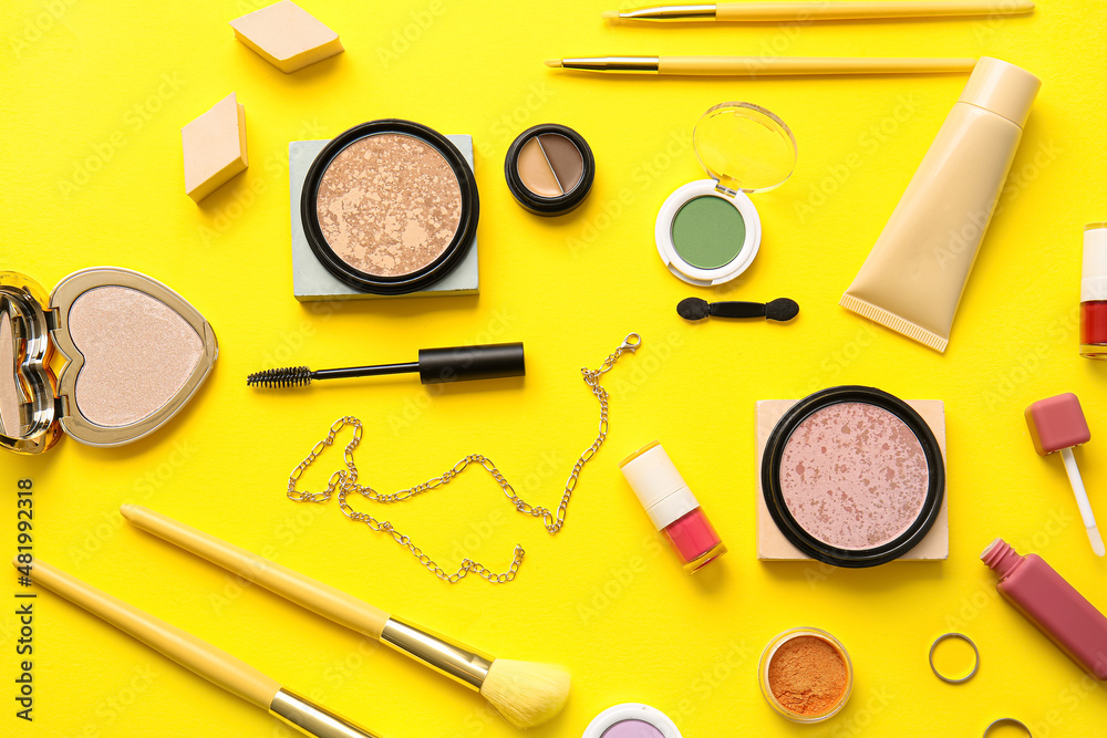 Decorative cosmetics on yellow background