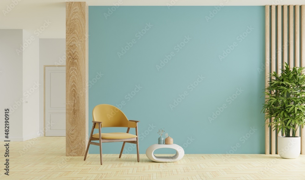 Mockup living room interior with armchair on empty blue color wall background.