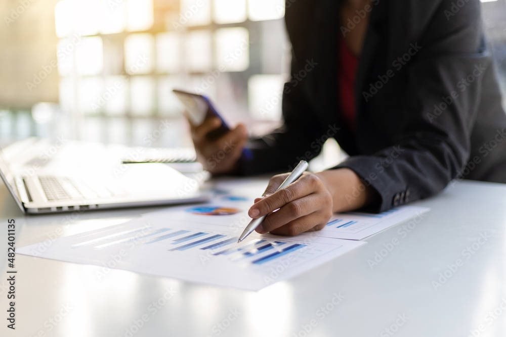 Close-up business people analyze business and make investment plans.