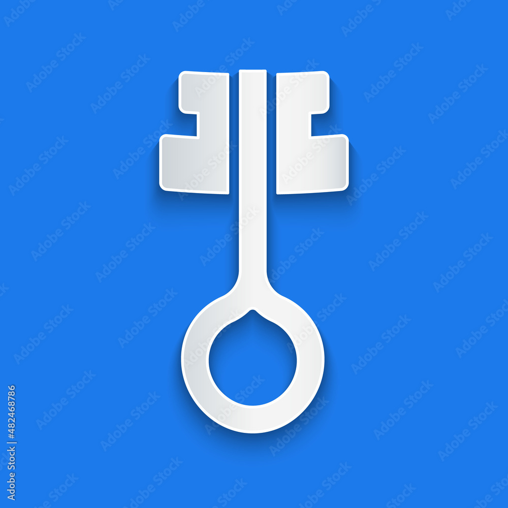 Paper cut Old magic key icon isolated on blue background. Paper art style. Vector