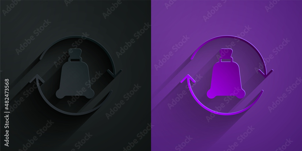 Paper cut Garbage bag with recycle symbol icon isolated on black on purple background. Trash can ico