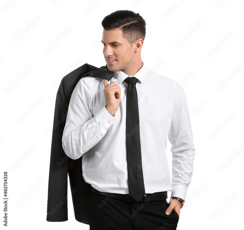 Handsome man in formal suit holding jacket over shoulder on white background