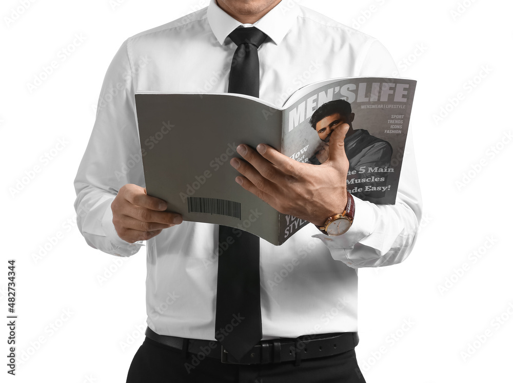 Handsome man in formal clothes reading magazine on white background, closeup