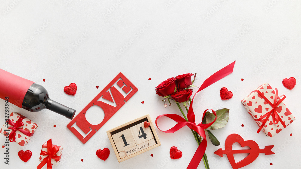 Calendar with date of Valentines Day, wine bottle, red roses and gift boxes on white background