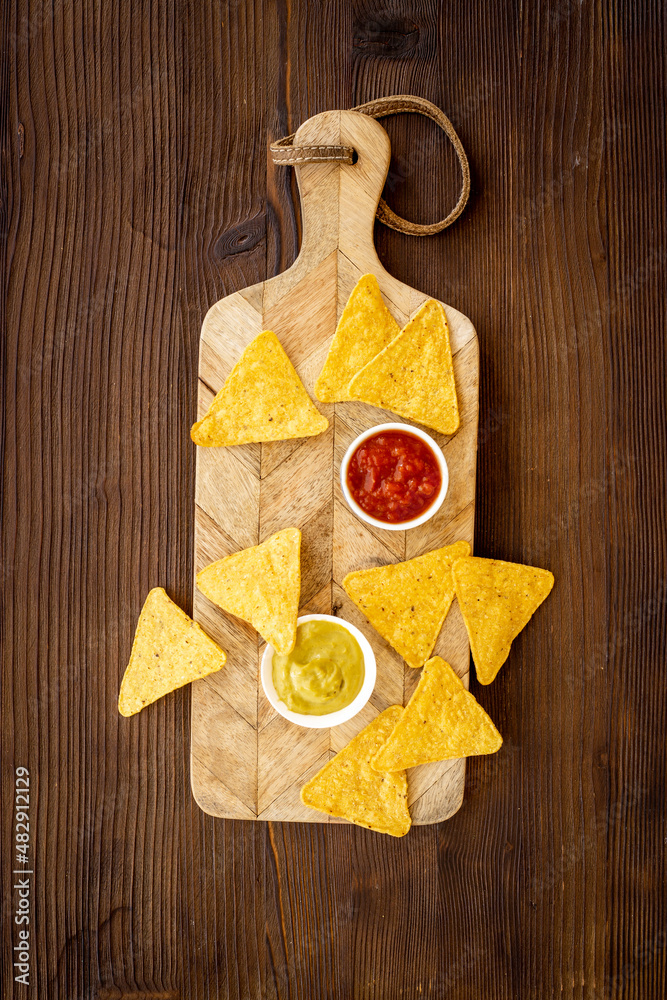 Snack for party corn nachos with salsa and guacamole sauces