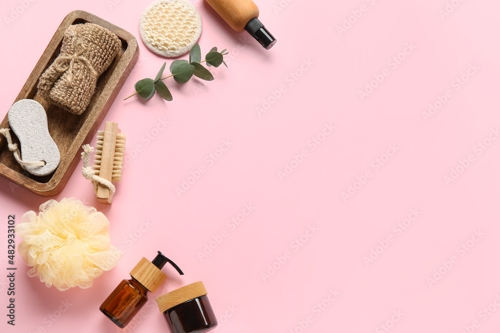 Composition with bath accessories and cosmetics on pink background