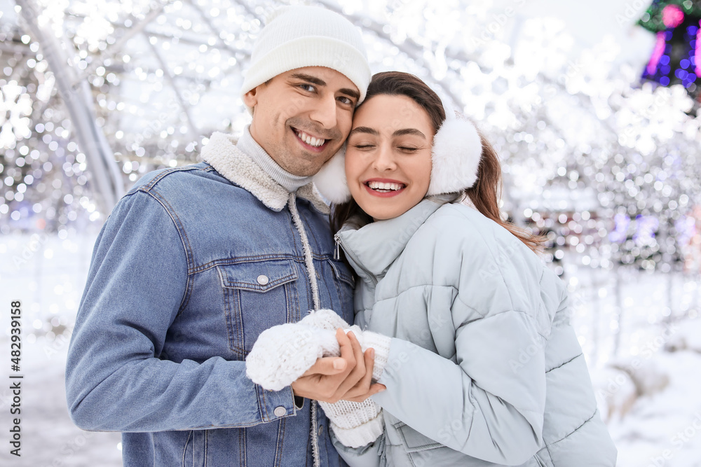 Pair of sweethearts on snowy winter day