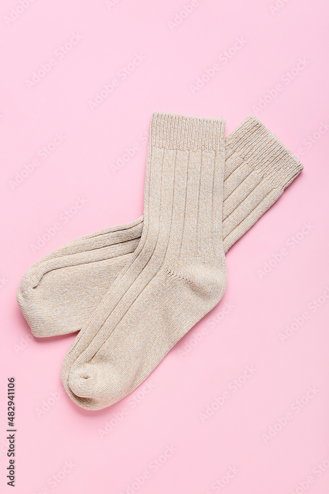 Pair of socks on pink background