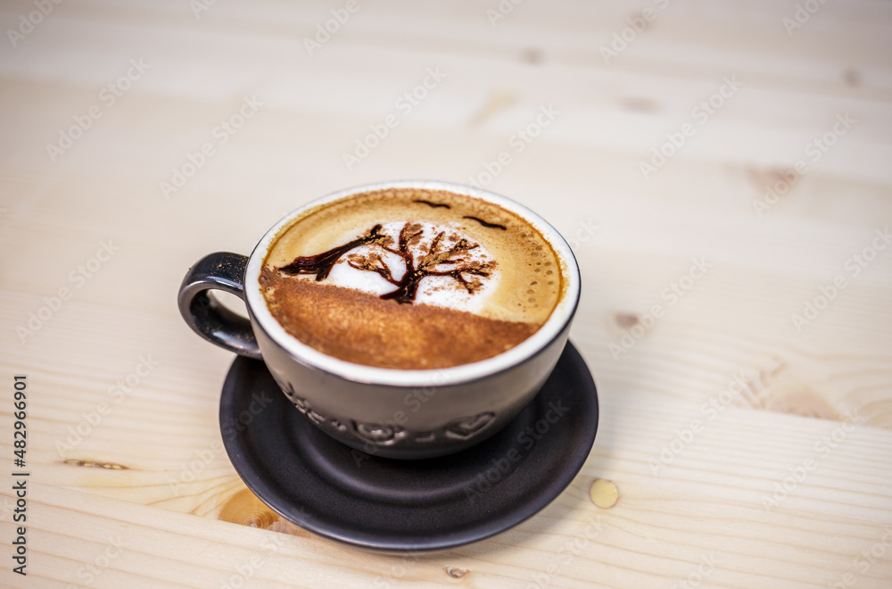 Artist draw coffee on table with wood background and coffee beans