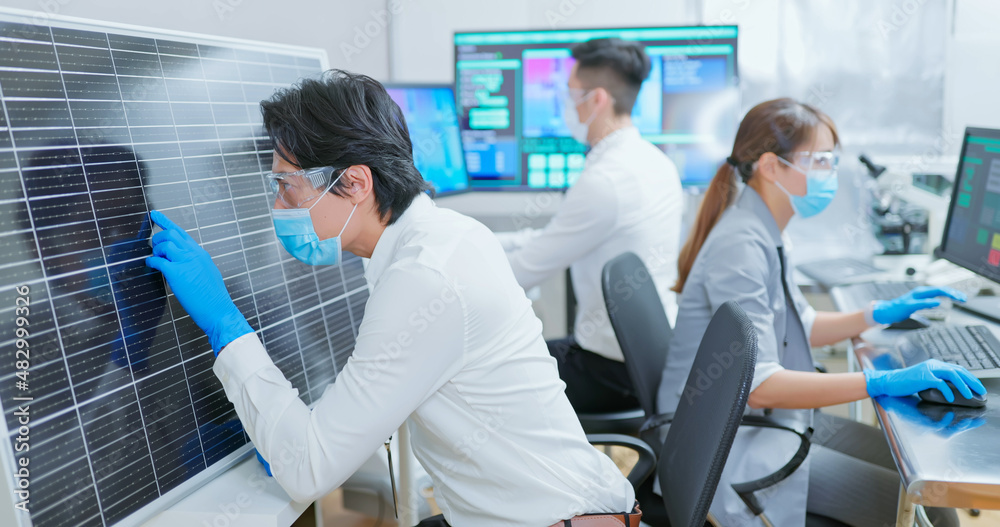 asian engineer with solar panel