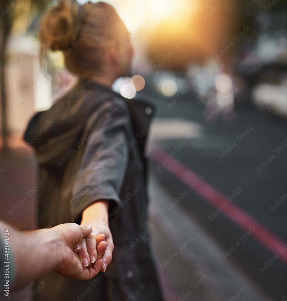 I want to show you something.... Shot of a young woman pulling on her boyfriends hand.