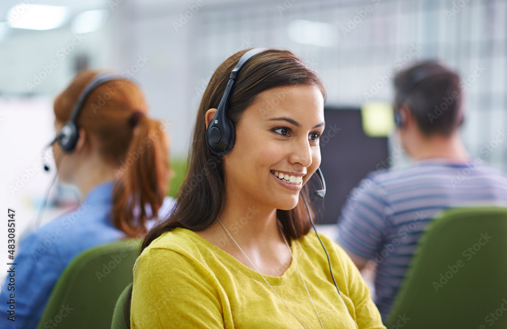 How can I help you. Shot of an attractive female at work wearing headsets.