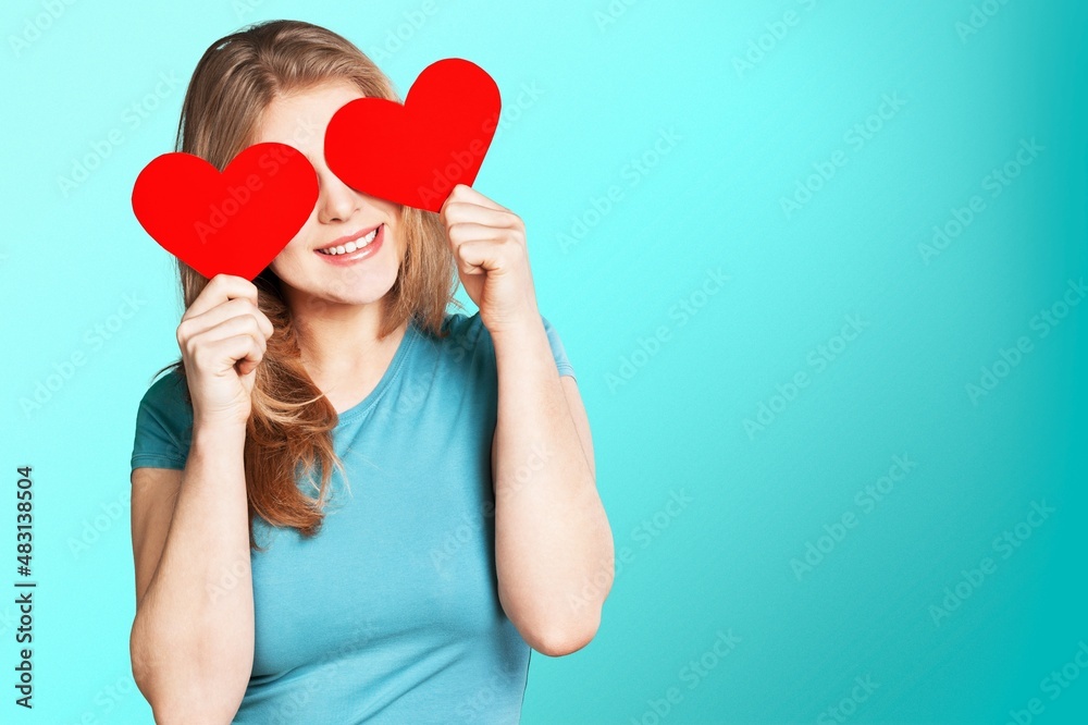 portrait of attractive happy smiling girl with heart, love holiday valentine symbol