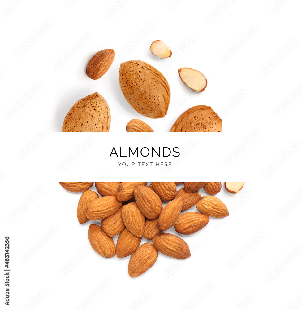 Creative layout made of almond nuts on the white background. Flat lay. Food concept.