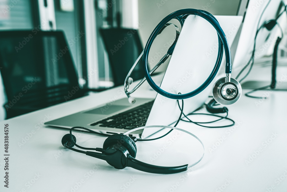 Headset and doctor equipment at clinic ready for actively support for patient by online video call .