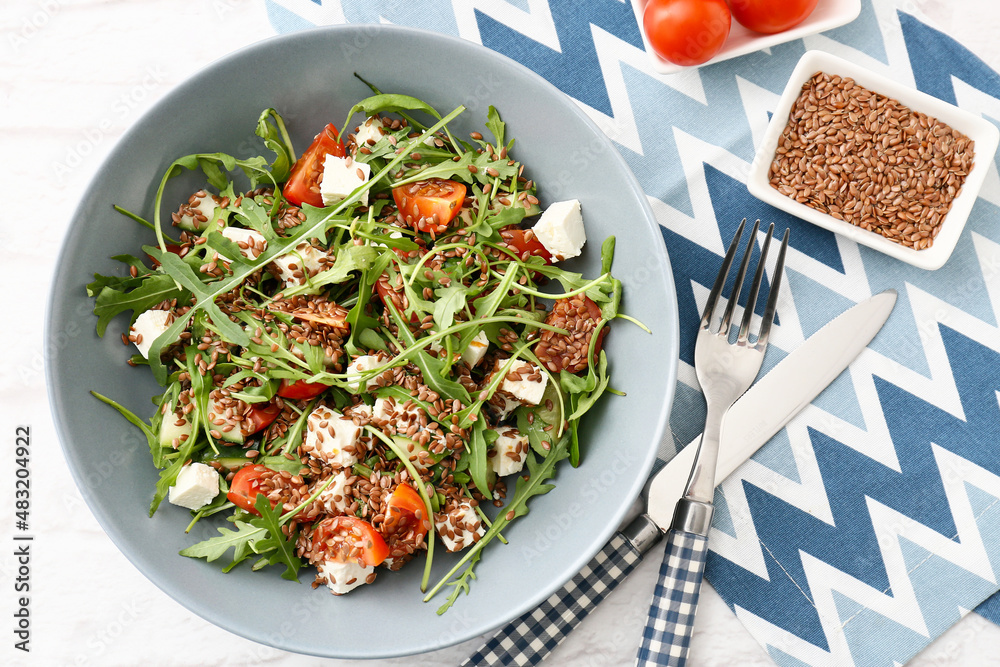 Bowl with tasty healthy vegetable salad on table