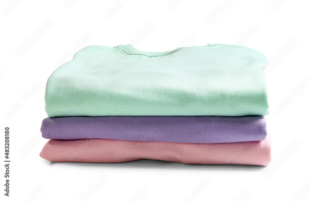 Stack of colorful clothes on white background