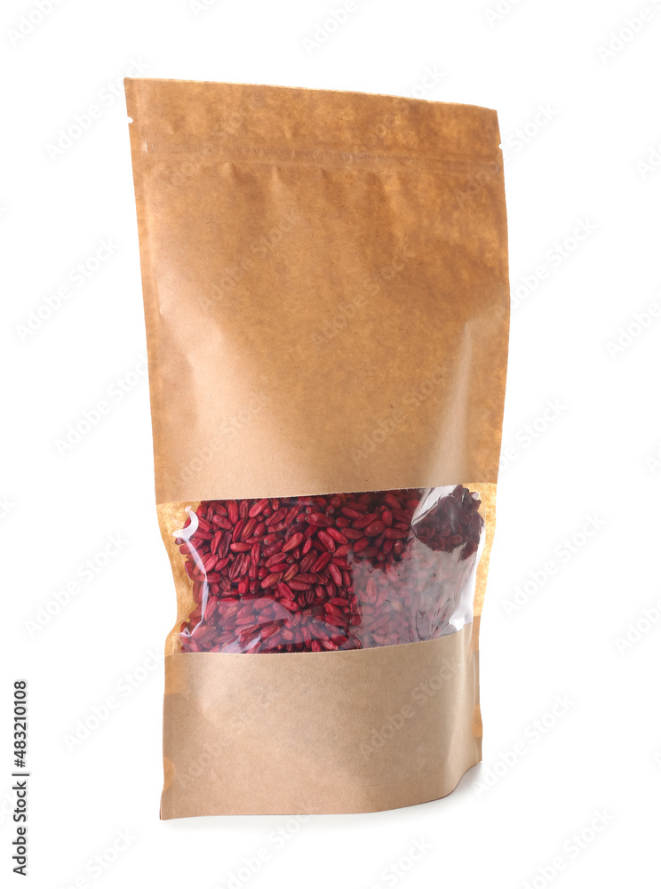 Bag with dried barberries on white background