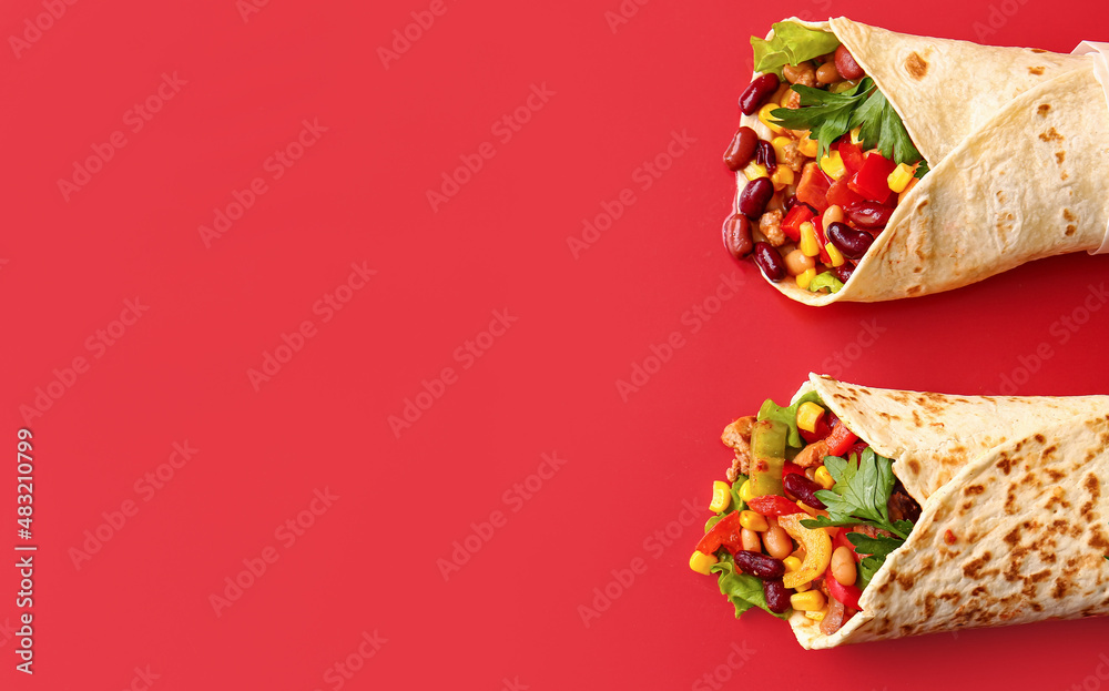 Delicious burritos on red background