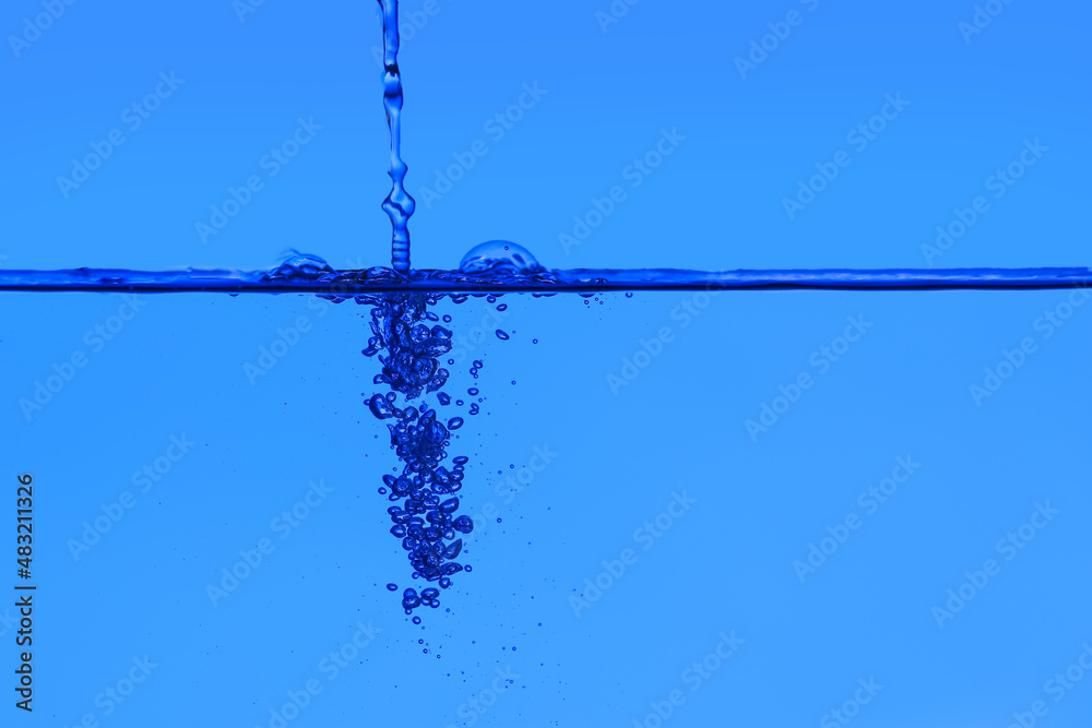 Clear water with air bubbles on blue background