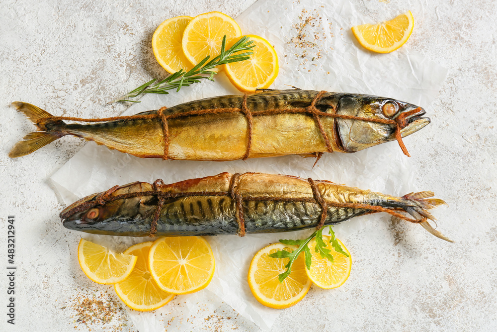 Smoked mackerel fishes on light background