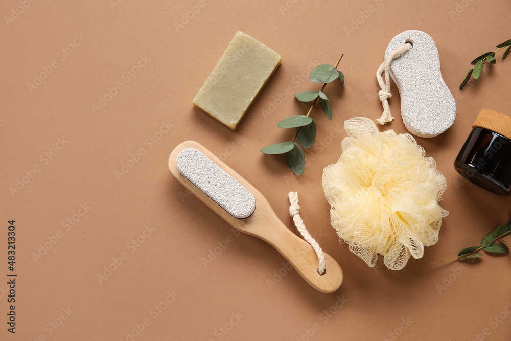 Bath supplies and eucalyptus branches on color background