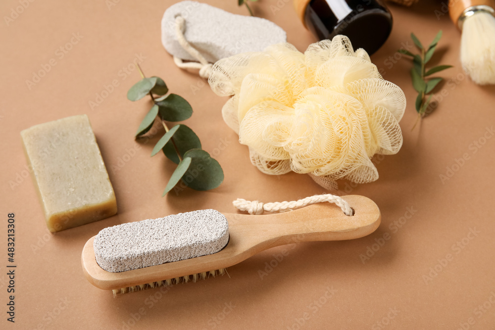 Bath supplies and eucalyptus branches on color background, closeup