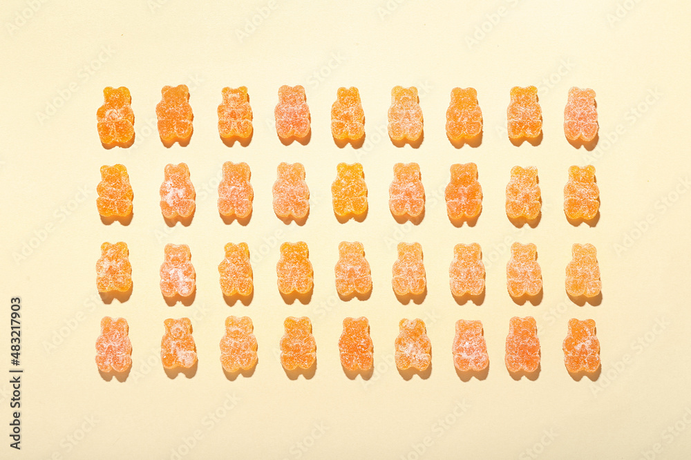 Orange jelly bears on light background