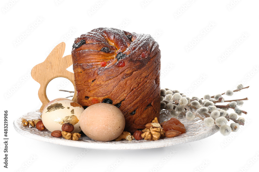 Plate with delicious Easter cake, eggs and pussy willow branches on white background