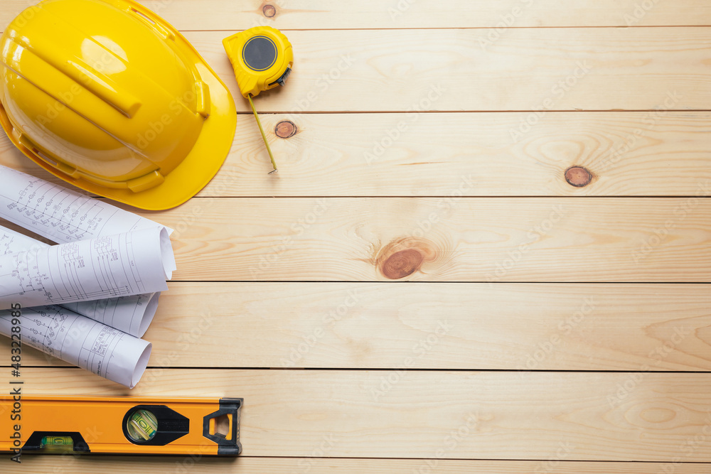 Work safety. Standard Construction site protective equipment on  top view wooden background, flat la