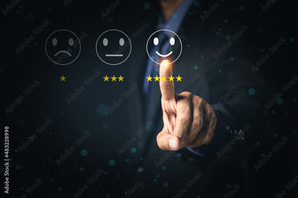 Customer Service and Satisfaction Concept Businessmen touch the virtual screen on happy smiley icons