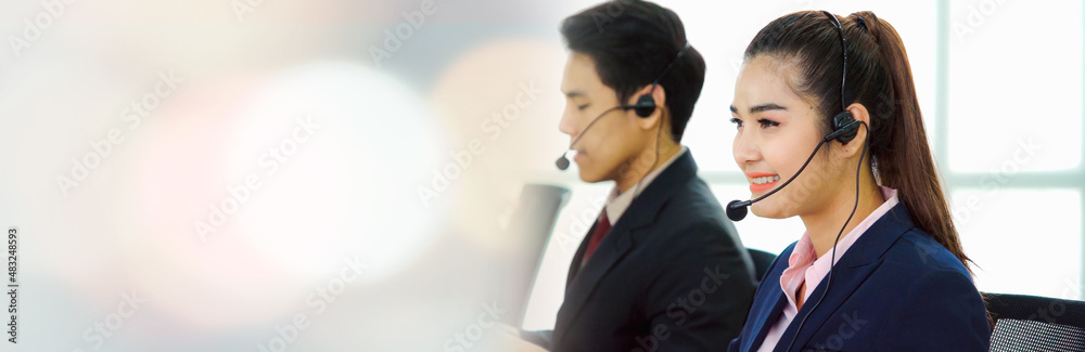 Business people wearing headset working in office in widen view to support remote customer or collea