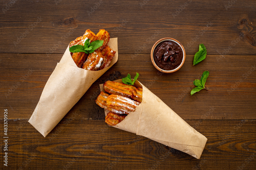 Churros street food dessert in paper bag