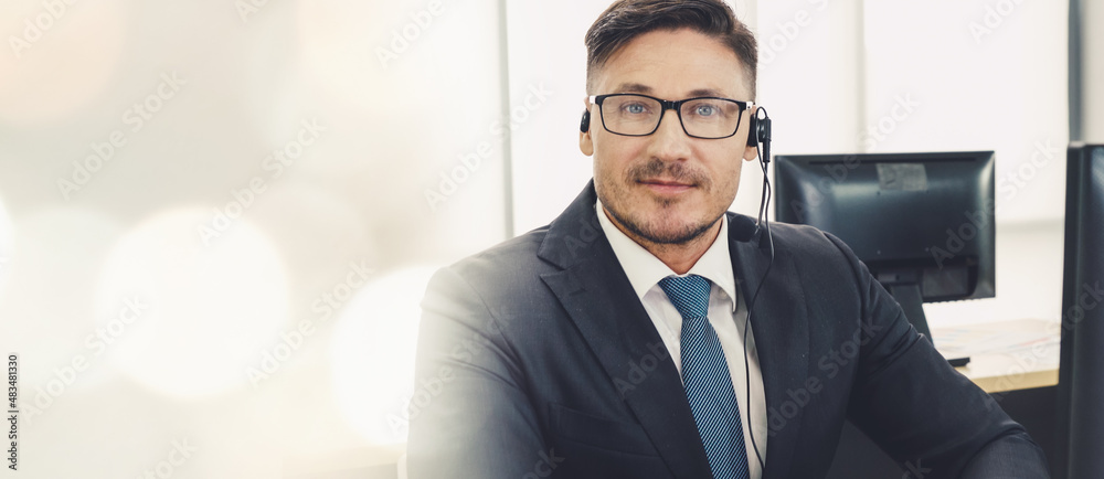 Business people wearing headset working in office to support remote customer or colleague. Call cent