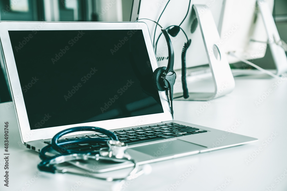 Headset and doctor equipment at clinic ready for actively support for patient by online video call .