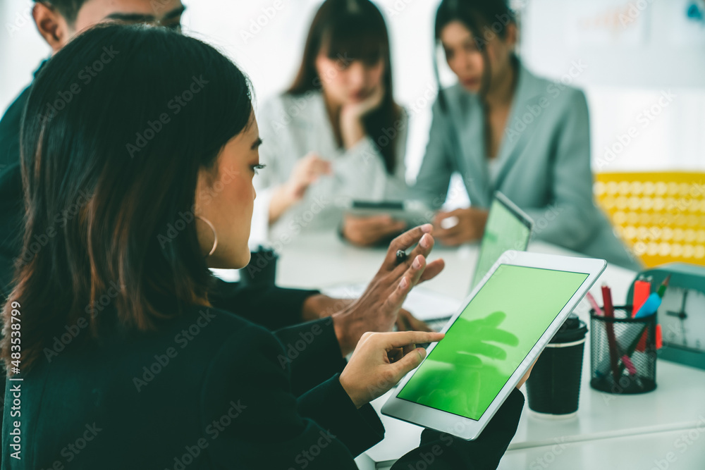 Businesswoman in business meeting using computer proficiently at office room . Corporate business te