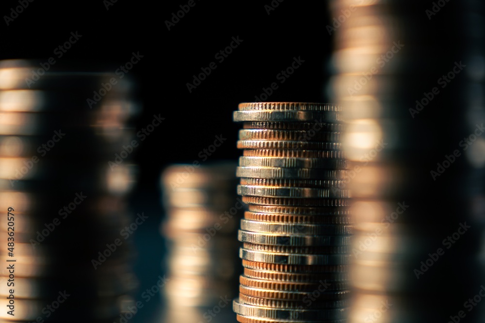 Pile of gold coins stack in finance treasury deposit bank account for saving . Concept of corporate 