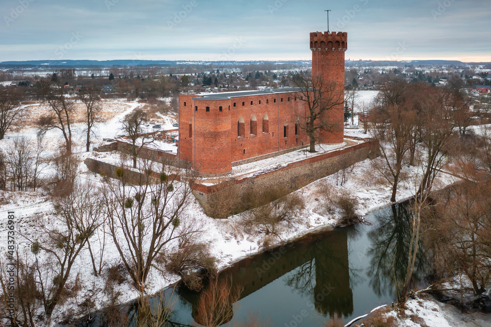 Teutonic Castle at the Wda river in winter scenery. Swiecie, Poland.