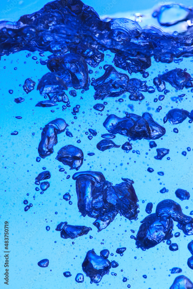 Clear water with air bubbles on blue background