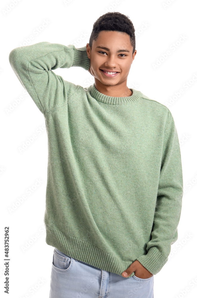 Handsome African-American guy in knitted sweater on white background