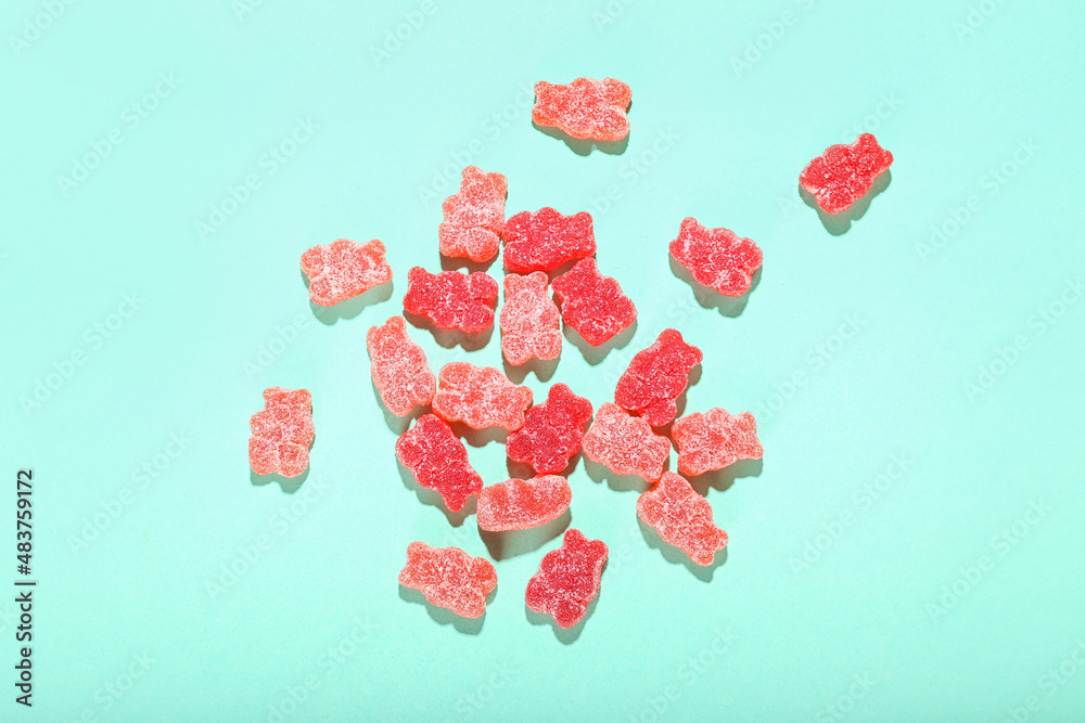 Tasty jelly bears on color background