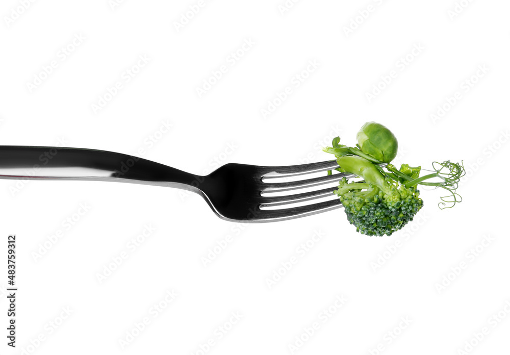 Fork with fresh vegetables on white background