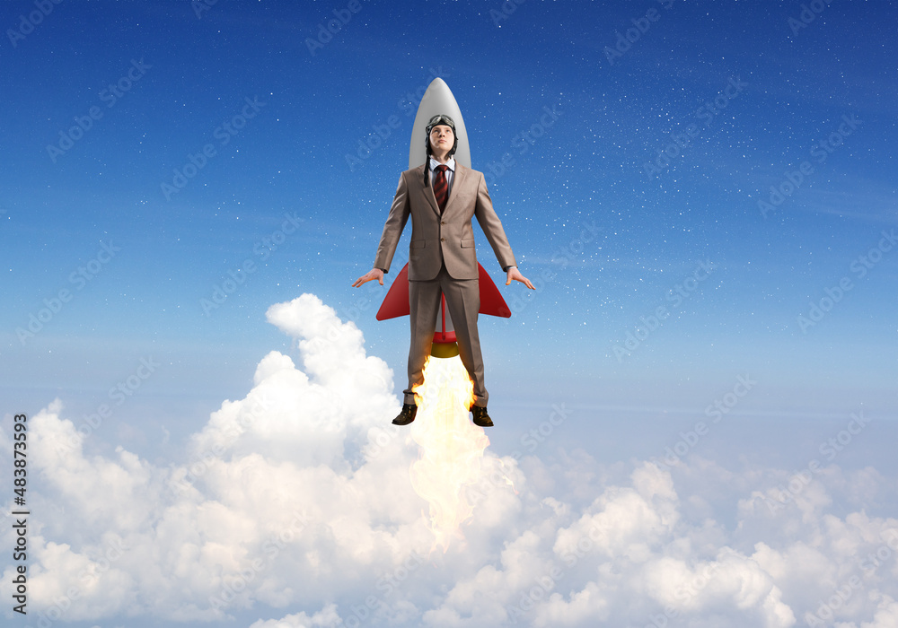 Business person in aviator hat flying on rocket