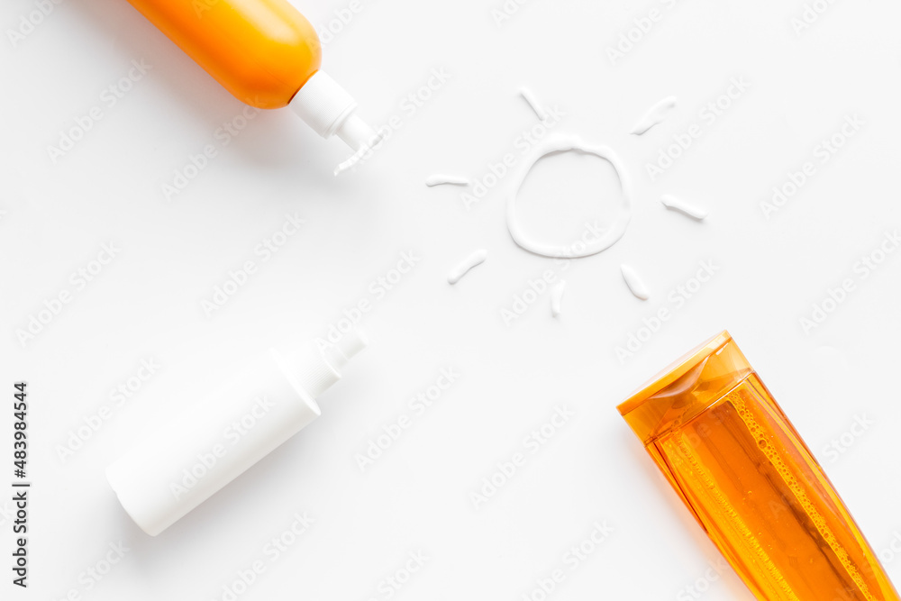 Suntanning lotion with cream in shape of sun, top view