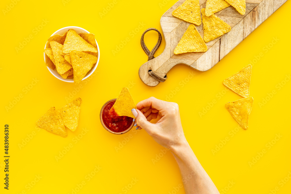 Mexican tortilla corn chips nachos with salsa sauce in bowl