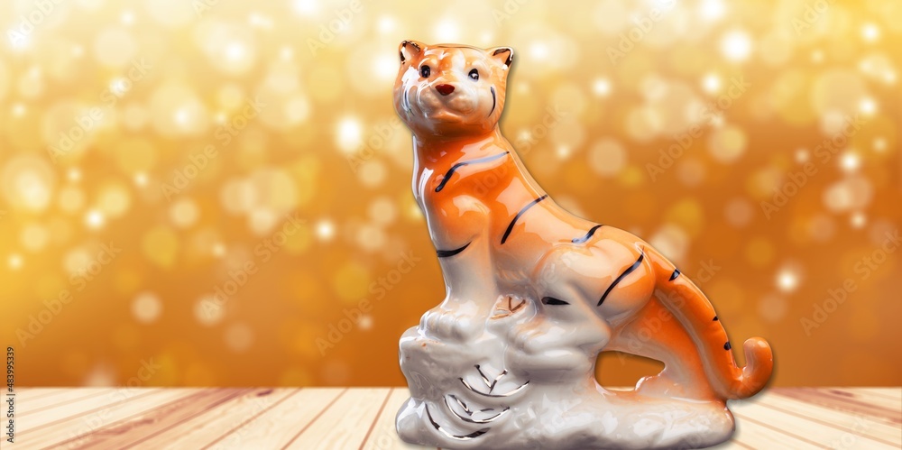 Chinese New Year of tiger 2022 on a wood table in the morning