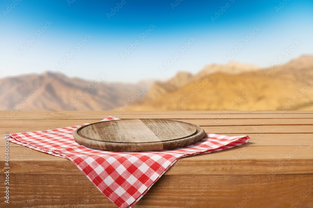 Empty wooden table with Mountain soft blurry background. Use as products display montage.